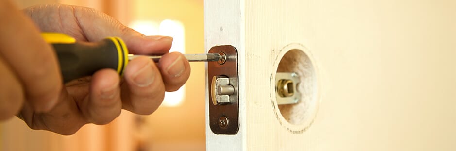 Handyman working on door